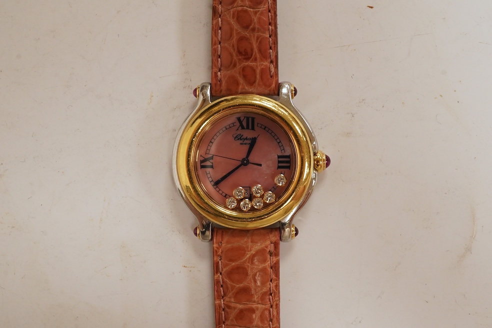 A lady's recent steel and gold Chopard 'Happy Sport' quartz wrist watch, the paua shell dial with seven 'floating' diamonds, on a leather strap wit gold plated Chopard clasp, with box, no papers. Condition - fair